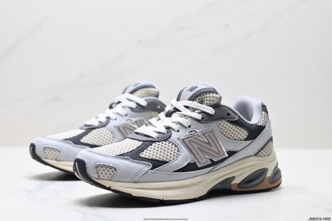 New Balance 2010 series athletic shoes, chunky style, breathable mesh fabric, suitable for running and casual wear.