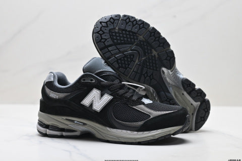 New Balance 2002R athletic shoes, men's and women's, breathable and cushioned, outdoor style.